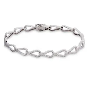 Elevate your wrist game with our platinum finish sterling silver teardrop tennis bracelet. Sparkling simulated diamonds