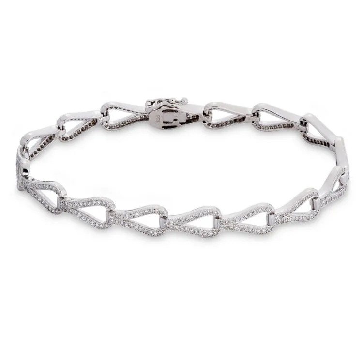 Elevate your wrist game with our platinum finish sterling silver teardrop tennis bracelet. Sparkling simulated diamonds